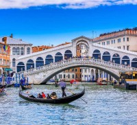 Gondola on Grand canal near Rialto bridgein Venice, Italy