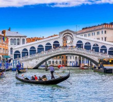 Gondola on Grand canal near Rialto bridgein Venice, Italy