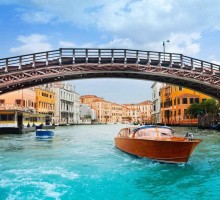 Ponte dell'Accademia in Venice and motorboats on grand canal in Venice