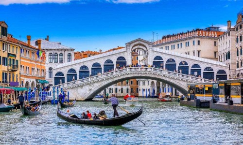 Gondola on Grand canal near Rialto bridgein Venice, Italy