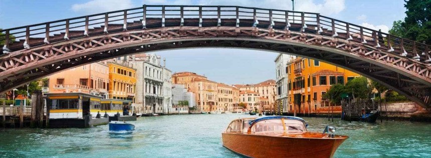 Ponte dell'Accademia in Venice and motorboats on grand canal in Venice